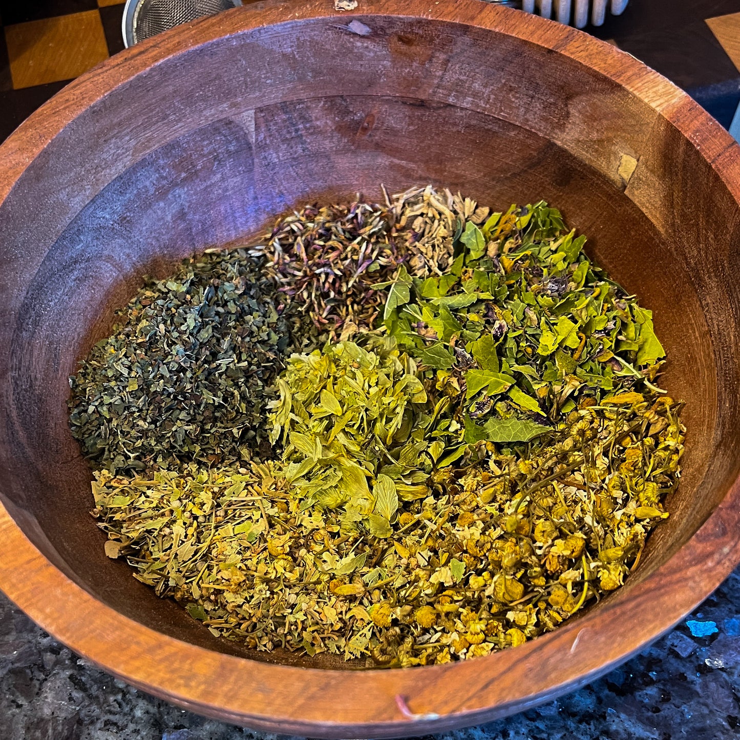 Say Goodnight Tea, a soothing herbal blend containing ingredients like Chamomile, Lavender, Valerian Root, and Hops, crafted to promote relaxation and support restful sleep.