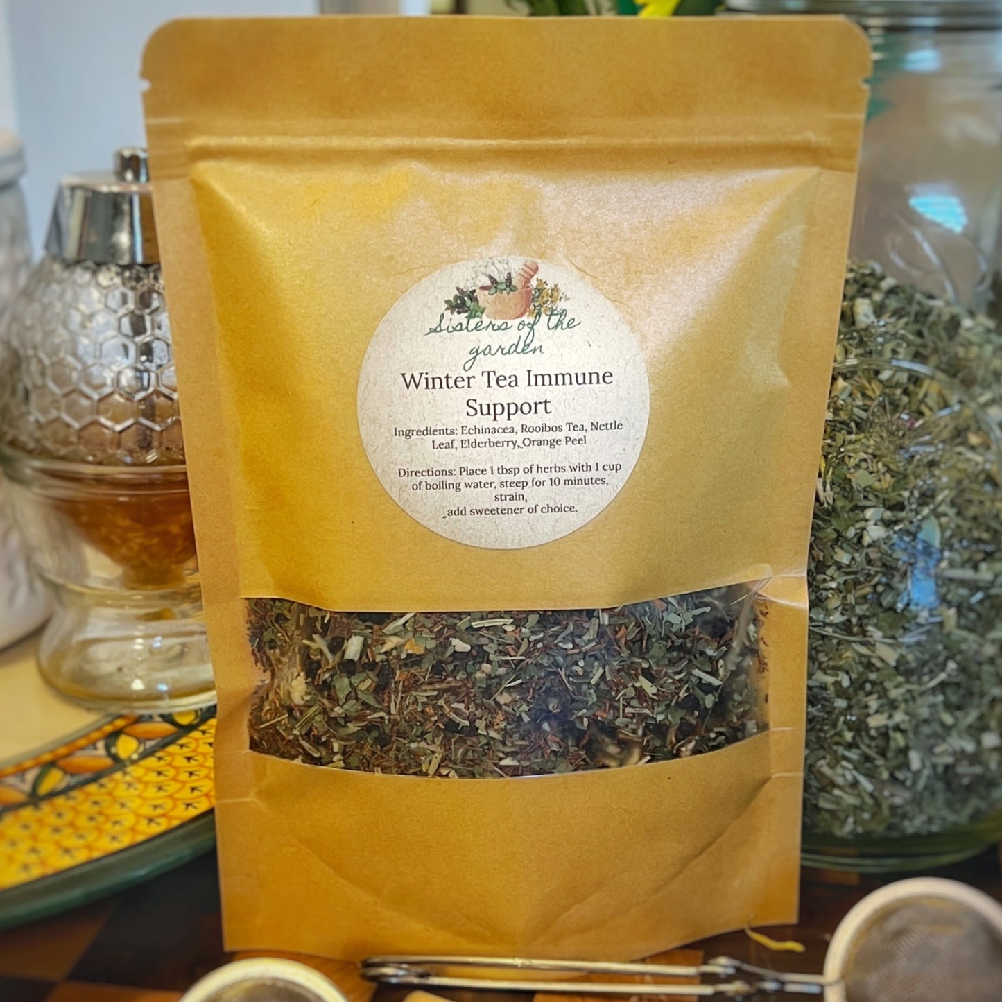 Winter Immune Tea, a herbal blend infused with ingredients like Rooibos, Echinacea, Nettle Leaf, Elderberry, and Orange Peel, designed to support immune health during the winter season.